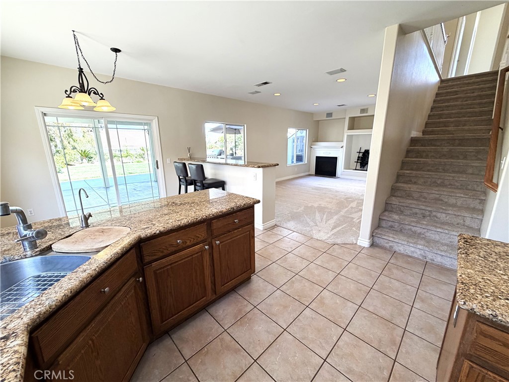 873 Greenridge Road Corona, CA 92882 - Photo 9 of 30 a large bathroom with a granite countertop sink a mirror and vanity