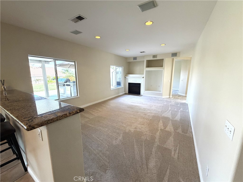873 Greenridge Road Corona, CA 92882 - Photo 10 of 30 a view of an empty room with a window