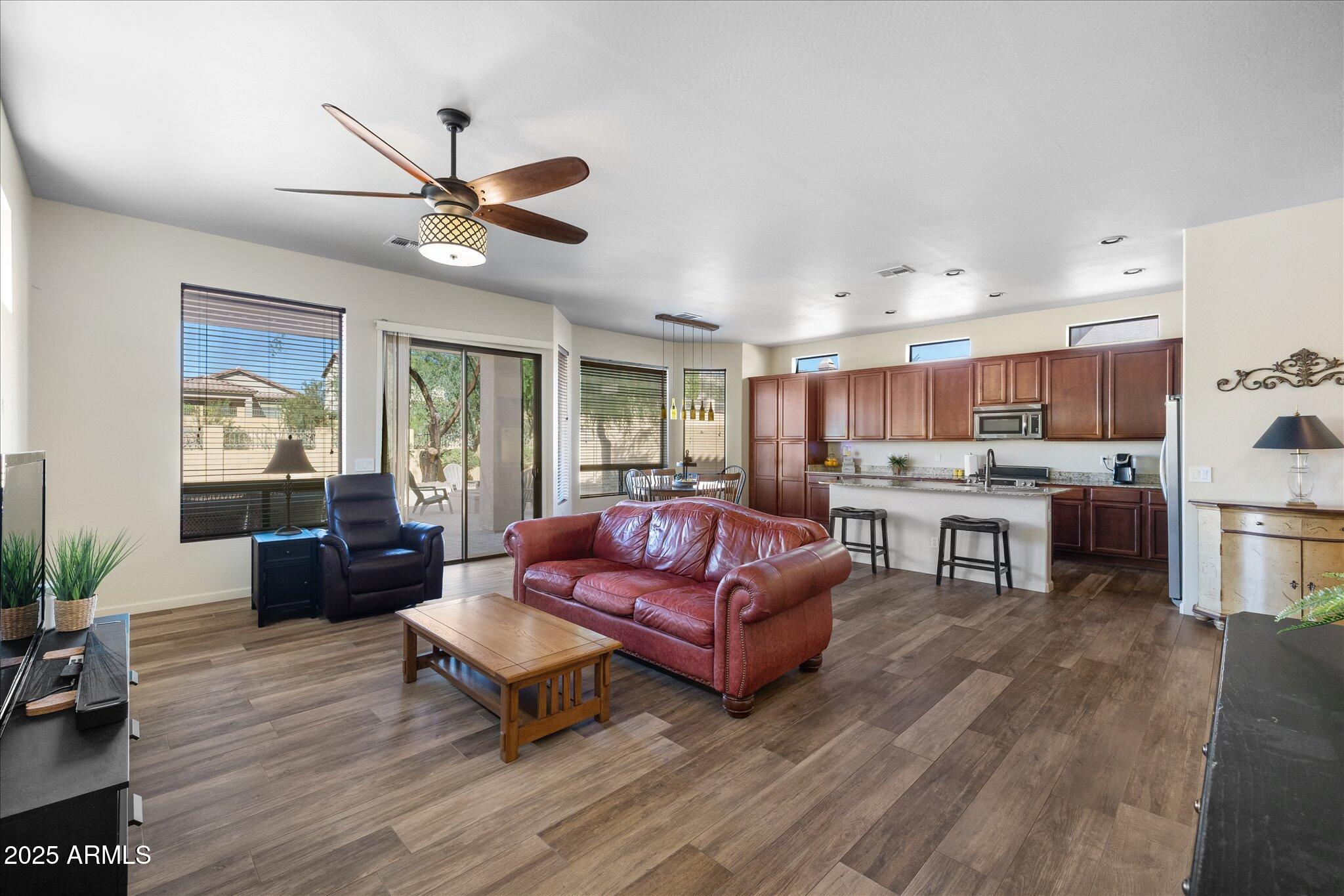 8536 East Inca Street Mesa, AZ 85207 - Photo 2 of 44 a living room with furniture kitchen view and a wooden floor
