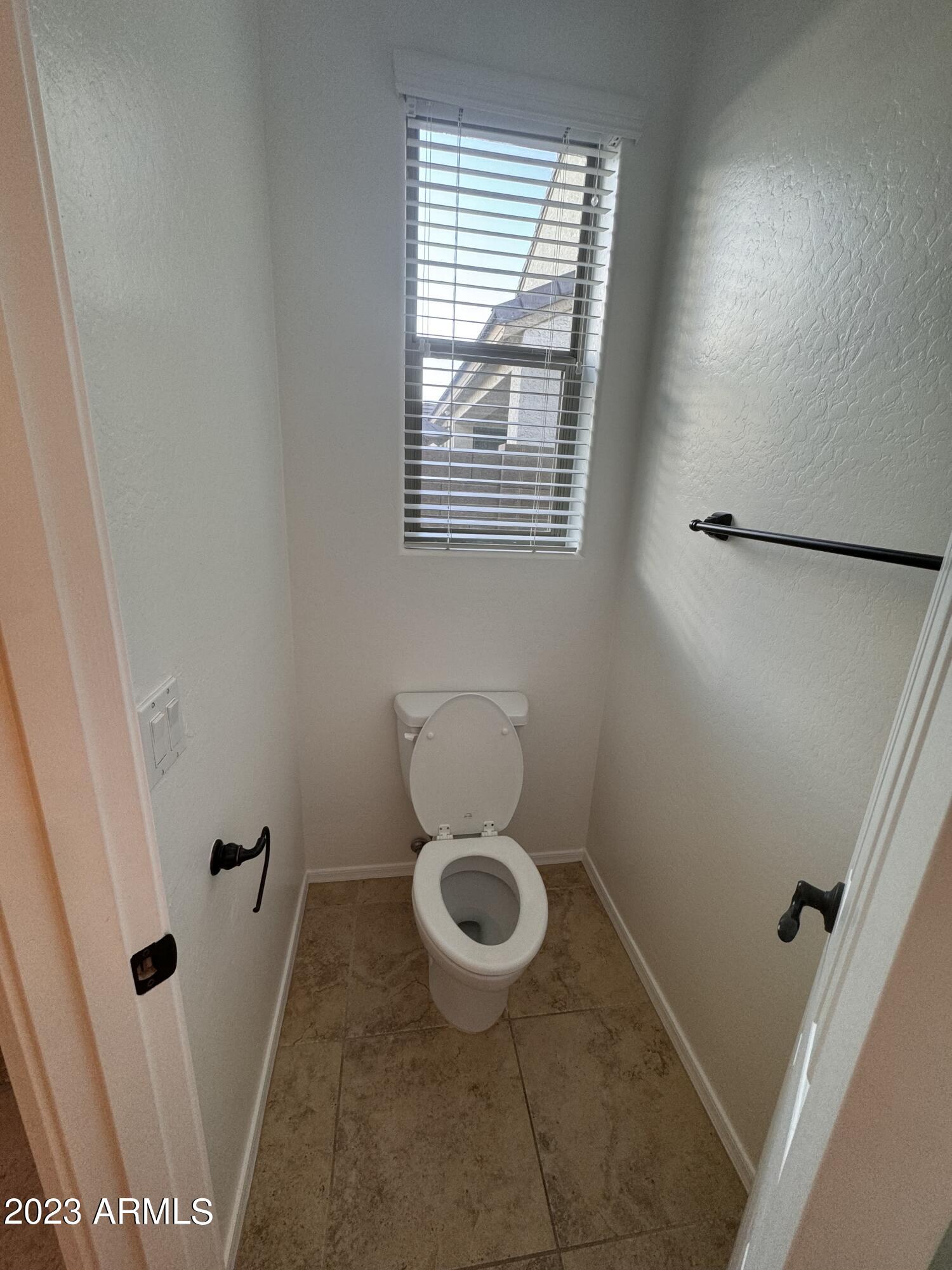 3753 East Phelps Street Gilbert, AZ 85295 - Photo 17 of 18 a bathroom with a toilet and a shower