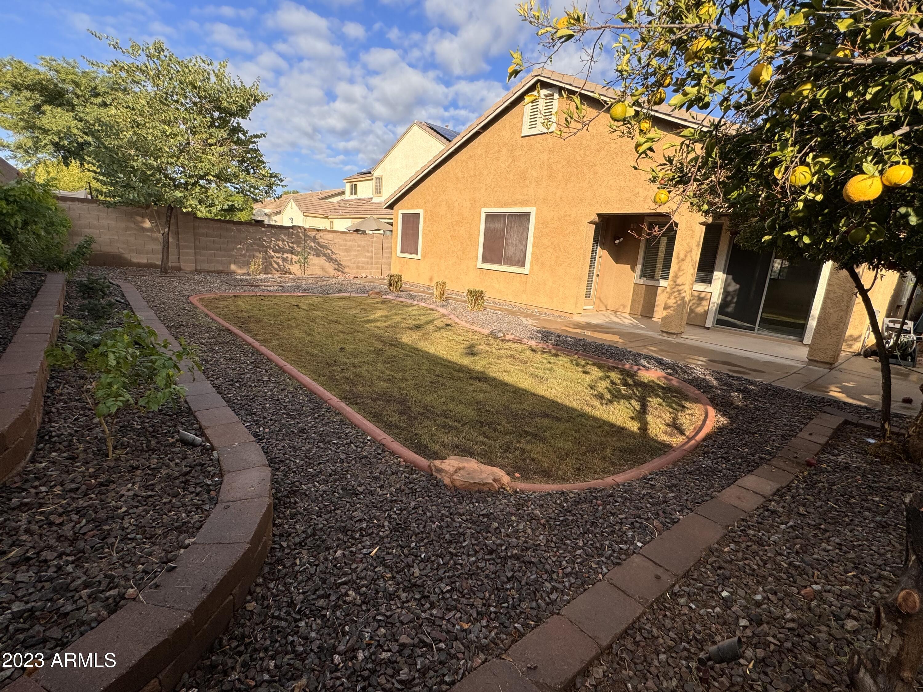 3753 East Phelps Street Gilbert, AZ 85295 - Photo 5 of 18 a view of a house with a backyard