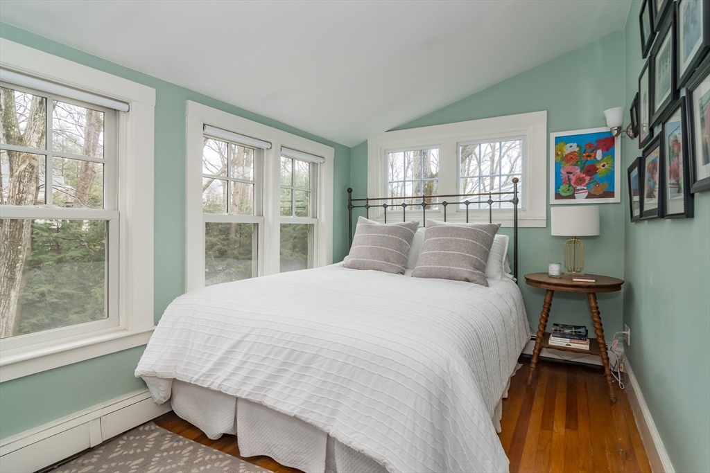 20 Colburn Road Wellesley, MA 02481 - Photo 17 of 31 a large bed sitting in a bedroom next to a window