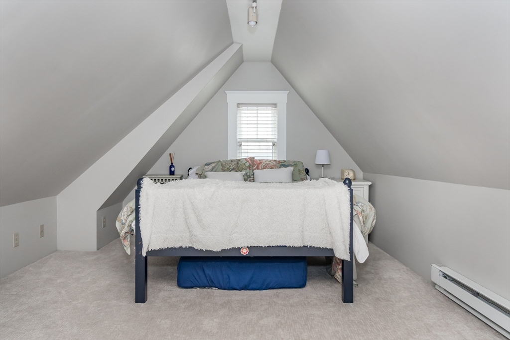 20 Colburn Road Wellesley, MA 02481 - Photo 20 of 31 a bed sitting in a room next to a window