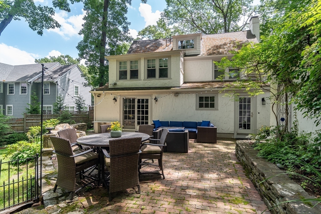 20 Colburn Road Wellesley, MA 02481 - Photo 24 of 31 a view of a house with backyard sitting area and garden