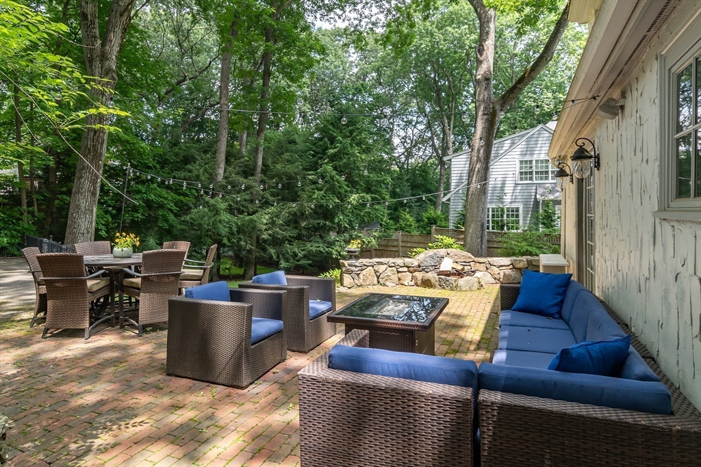20 Colburn Road Wellesley, MA 02481 - Photo 26 of 31 a view of a patio with couches table and chairs and potted plants