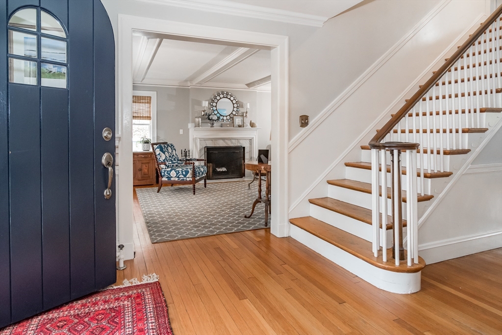 20 Colburn Road Wellesley, MA 02481 - Photo 3 of 31 a view of staircase with wooden floor and a rug