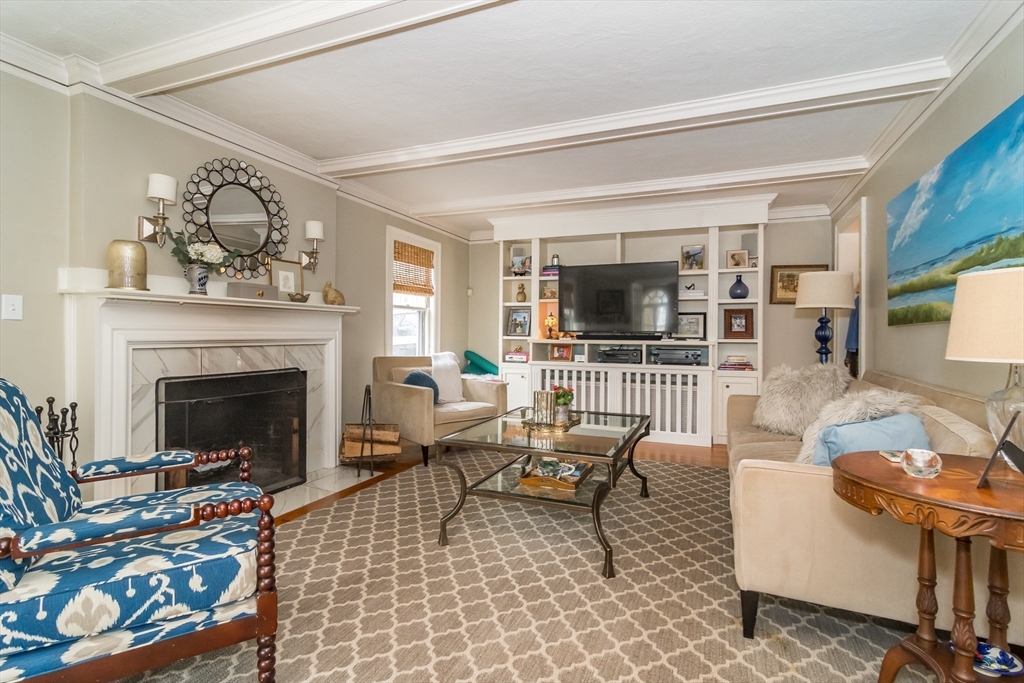 20 Colburn Road Wellesley, MA 02481 - Photo 6 of 31 a living room with furniture a flat screen tv and a fireplace