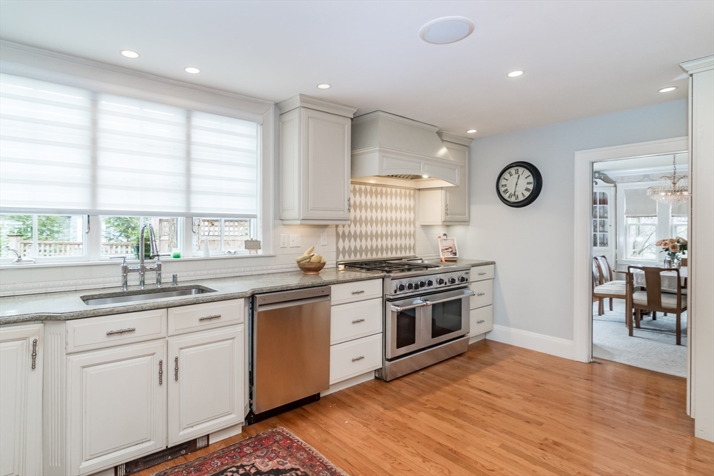 20 Colburn Road Wellesley, MA 02481 - Photo 10 of 31 a kitchen with granite countertop stainless steel appliances a stove and a large window