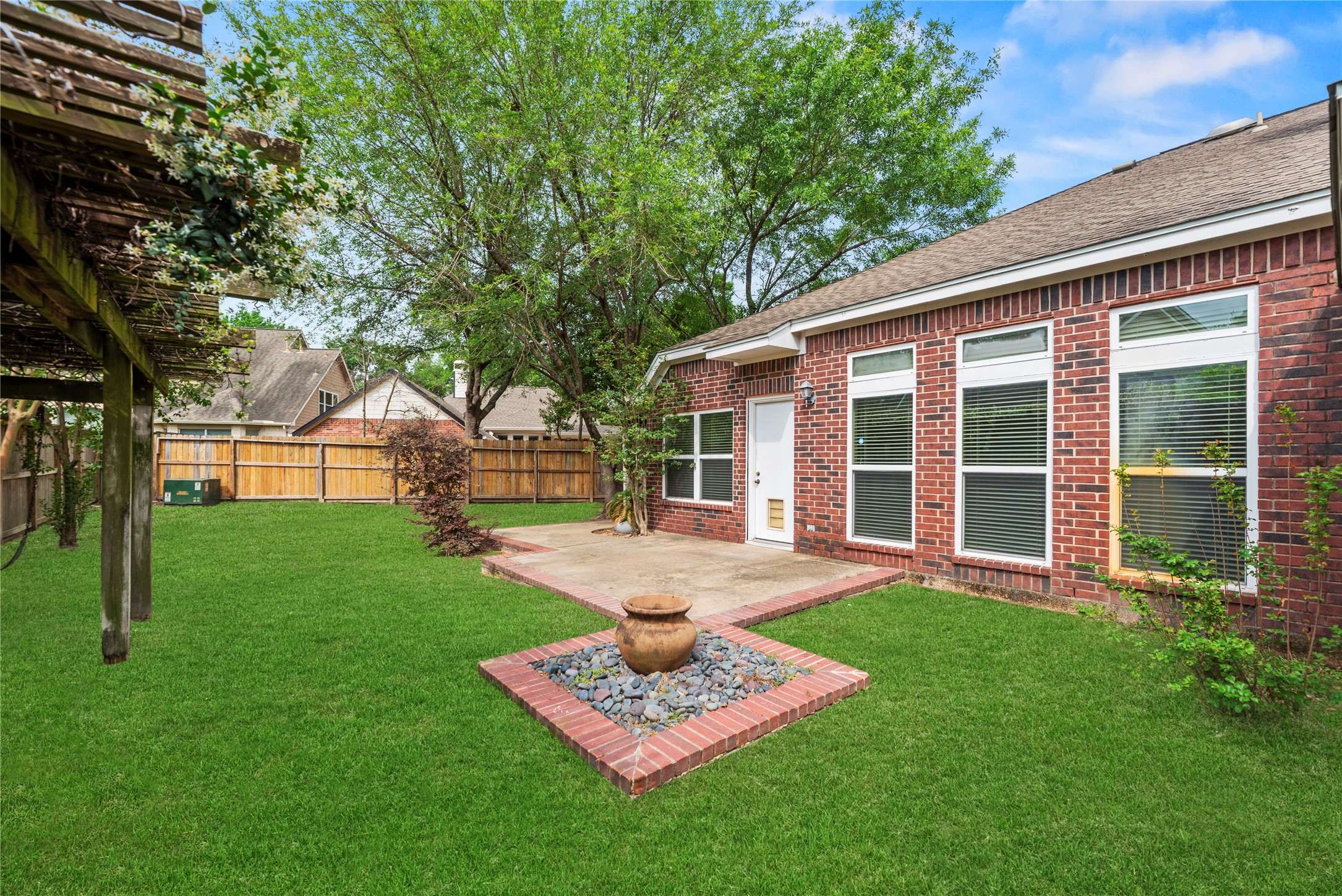 11619 Cedarvale Lane Tomball, TX 77377 - Photo 15 of 32 a front view of a house with a yard table and chairs