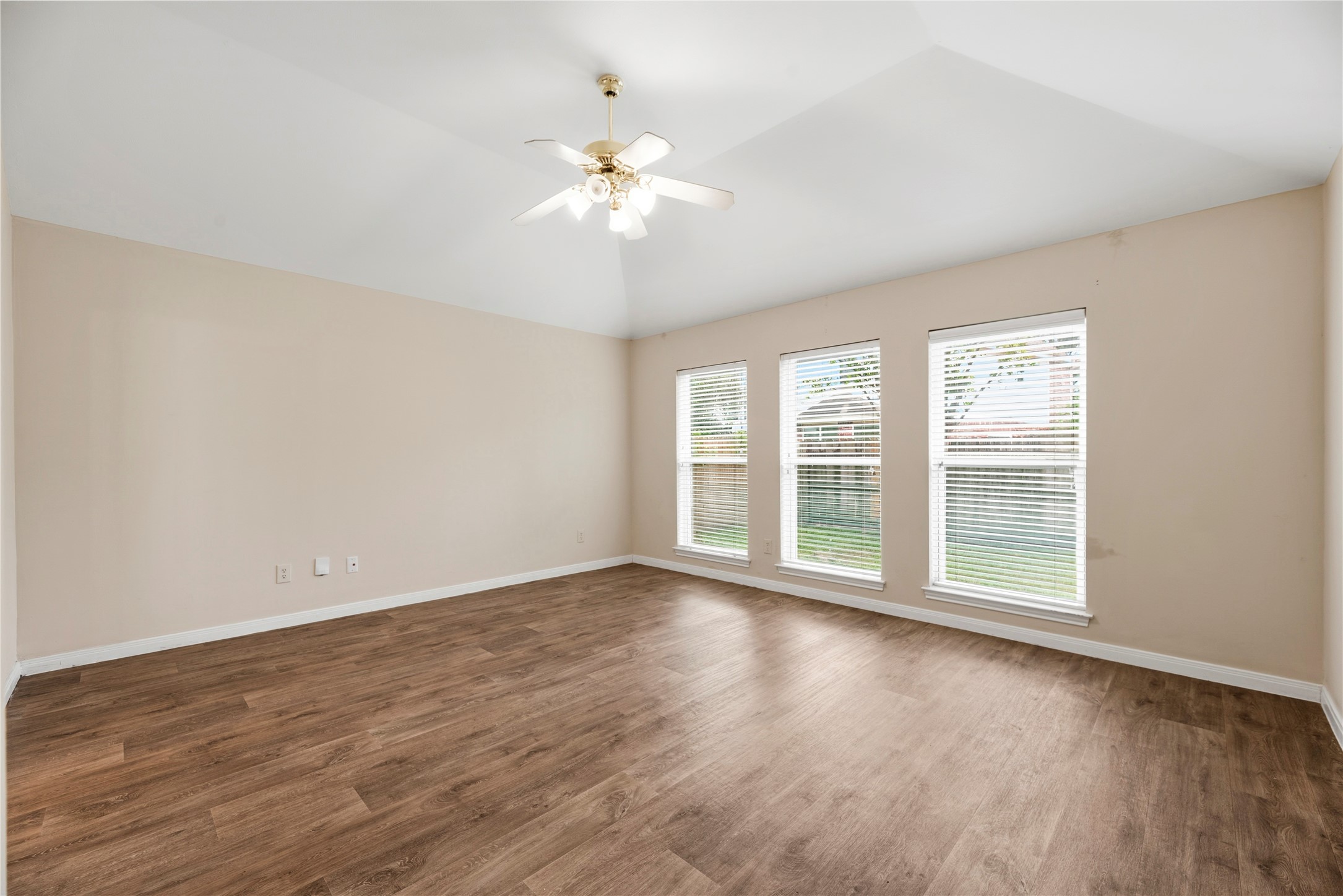 11619 Cedarvale Lane Tomball, TX 77377 - Photo 19 of 32 a view of an empty room with wooden floor and a window