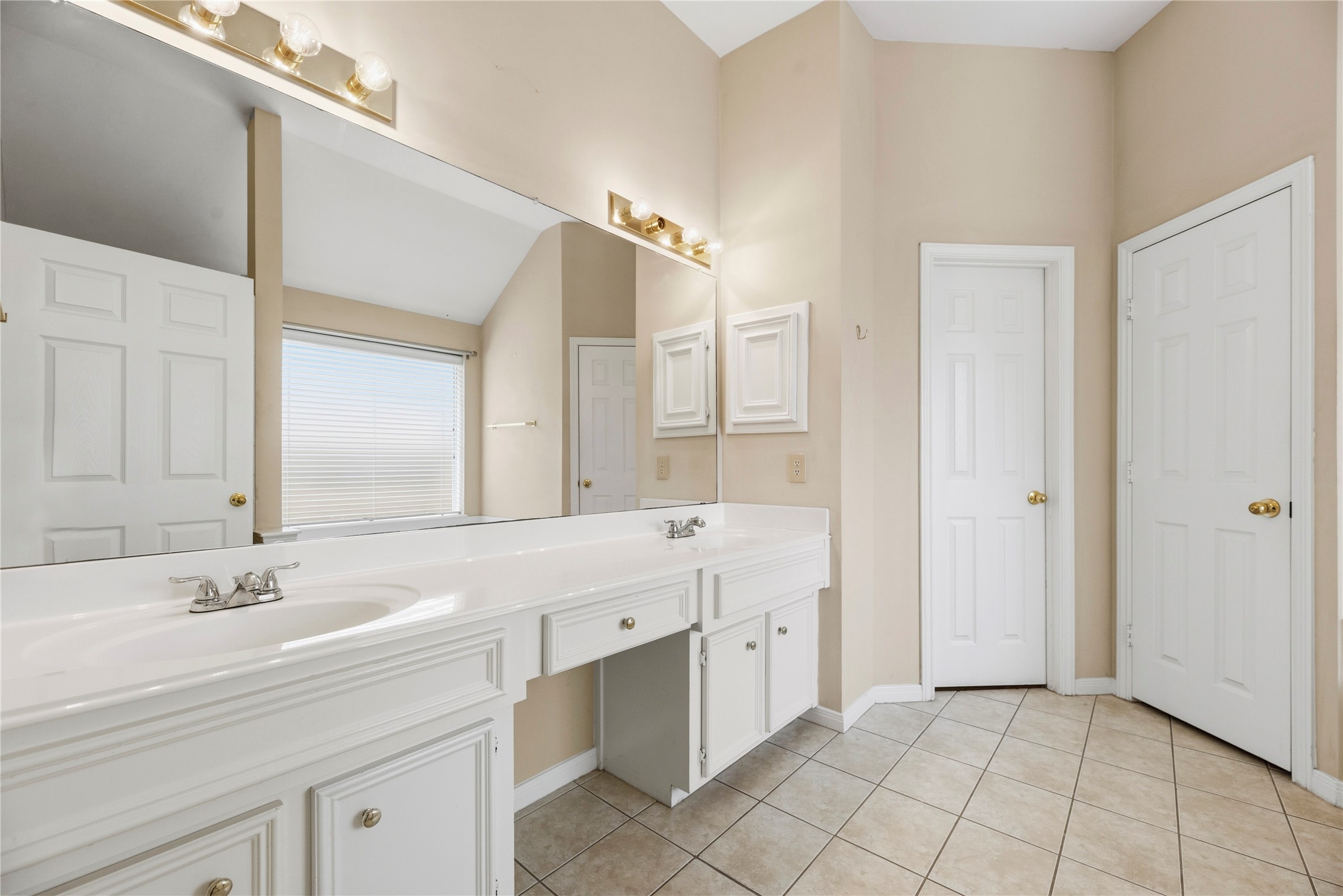 11619 Cedarvale Lane Tomball, TX 77377 - Photo 20 of 32 a bathroom with a double vanity sink mirror and double
