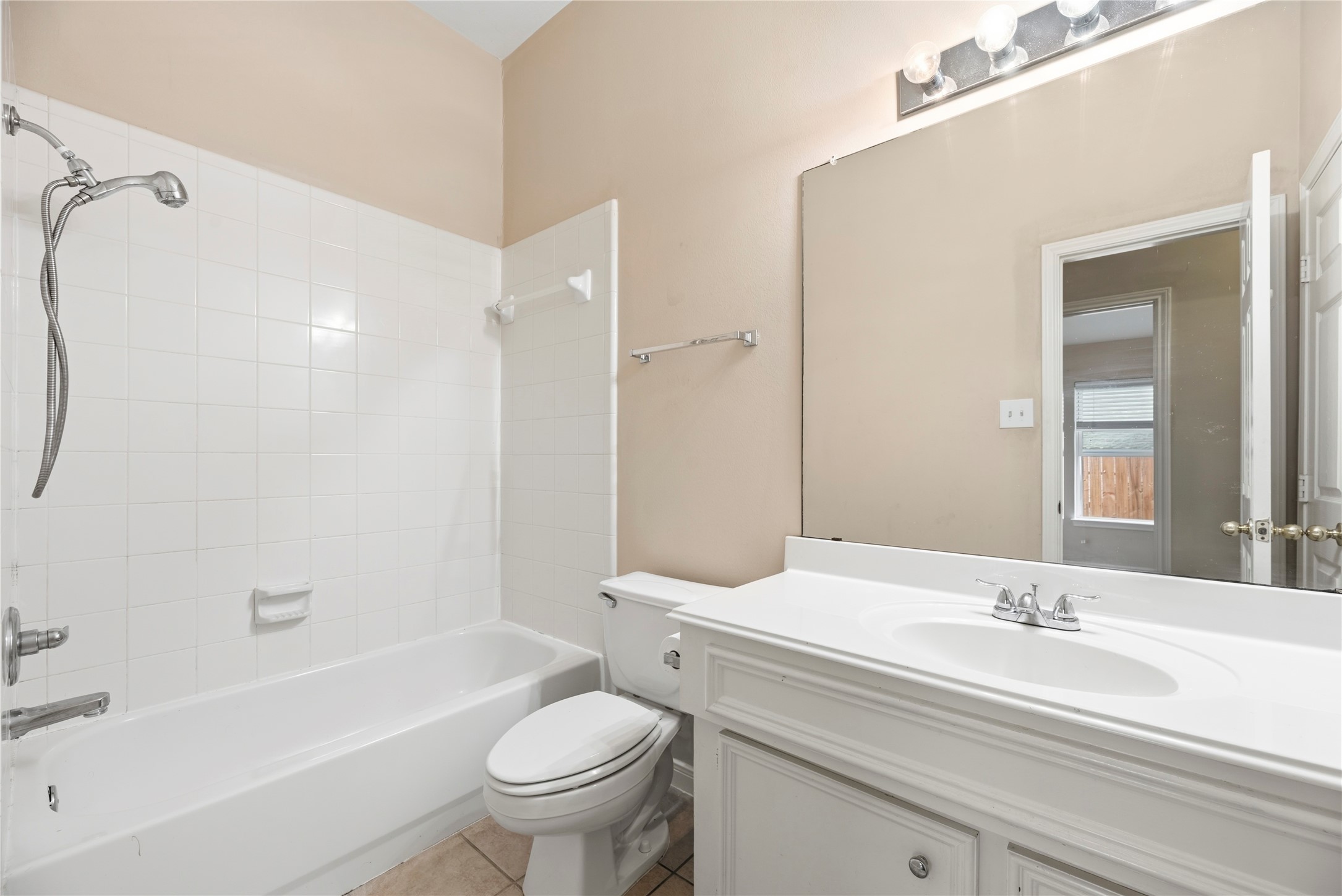 11619 Cedarvale Lane Tomball, TX 77377 - Photo 27 of 32 a bathroom with a sink a toilet and a bathtub