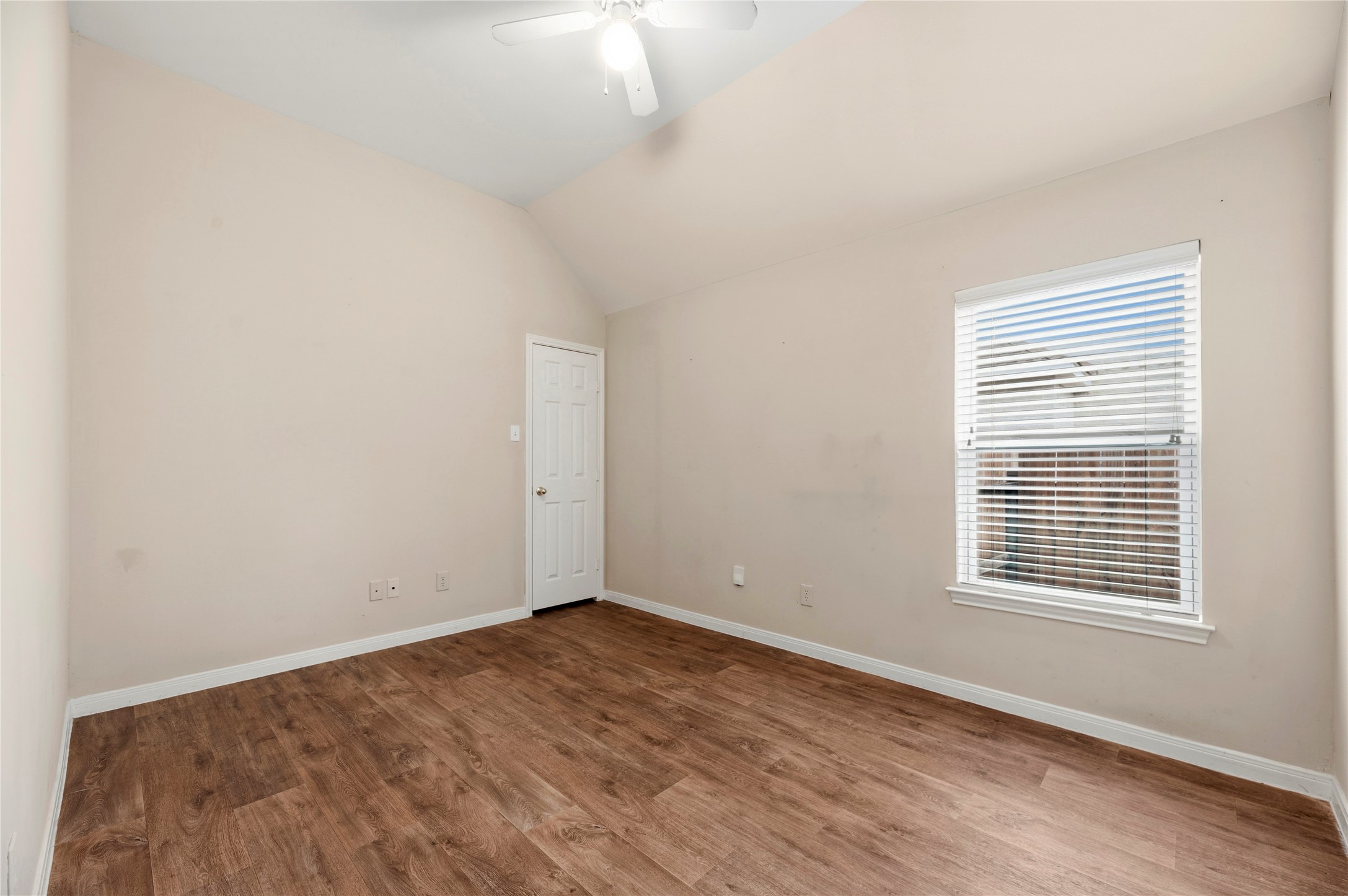 11619 Cedarvale Lane Tomball, TX 77377 - Photo 29 of 32 a view of an empty room with wooden floor and a window