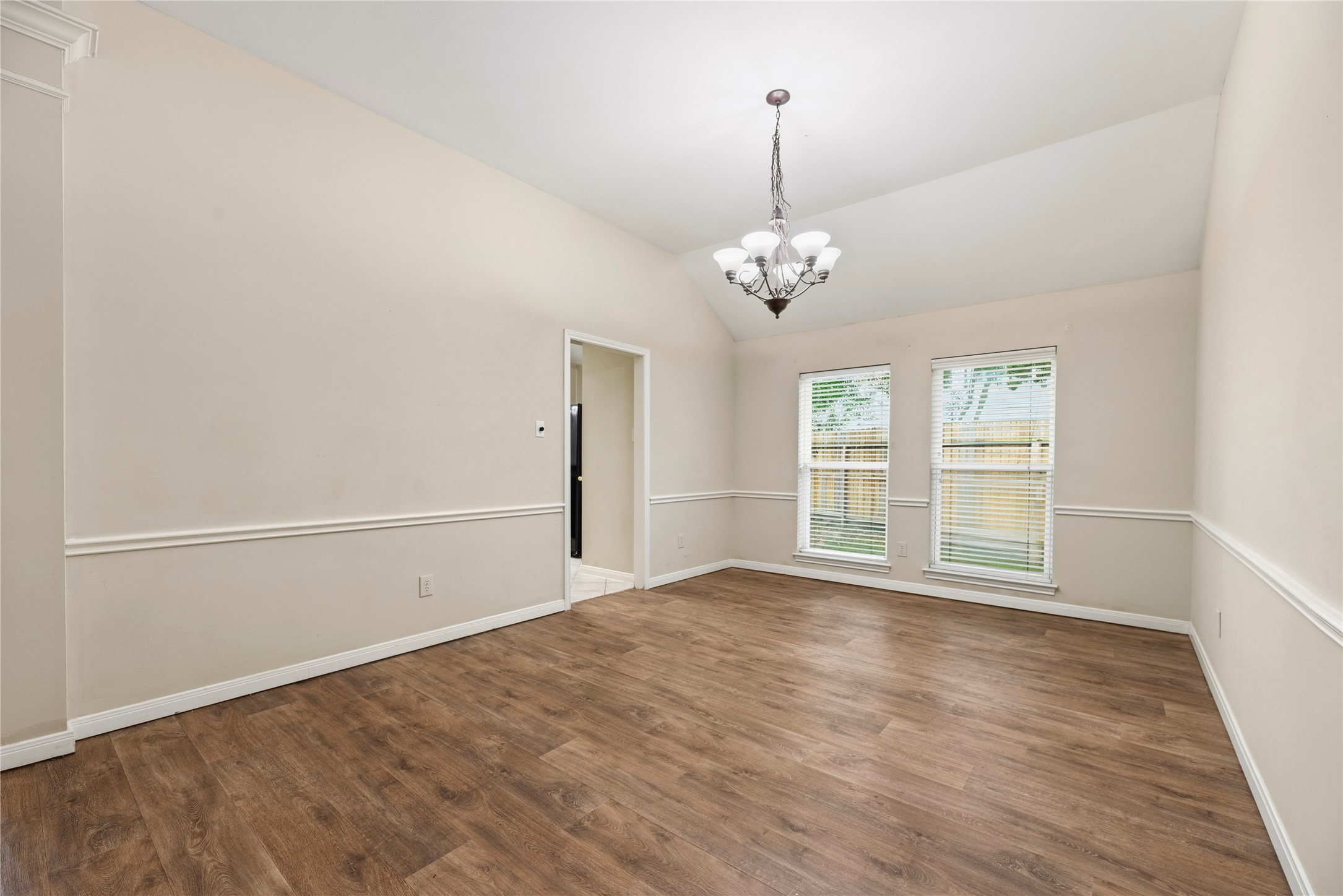11619 Cedarvale Lane Tomball, TX 77377 - Photo 3 of 32 a view of empty room with wooden floor and fan