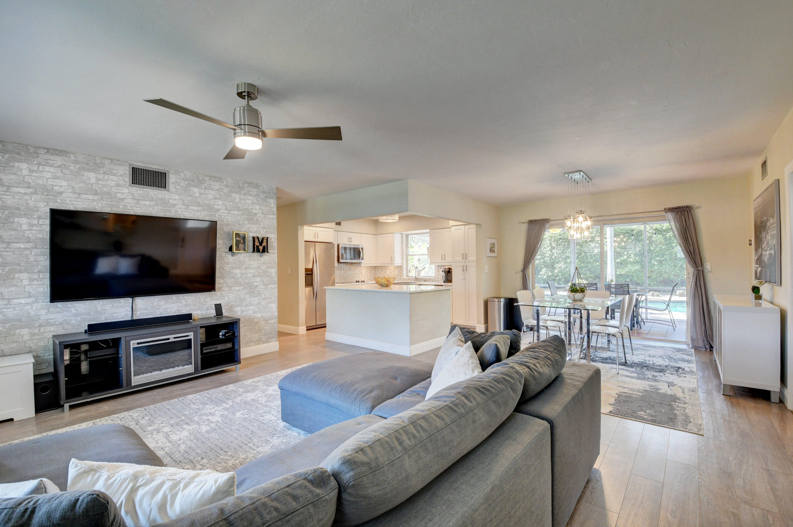 956 Southwest 4th Street Boca Raton, FL 33486 - Photo 7 of 52 a living room with furniture and a flat screen tv