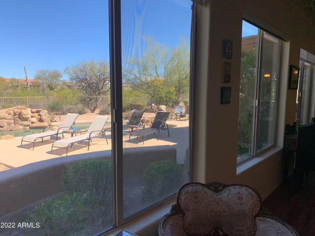 a view of balcony with furniture and outdoor view