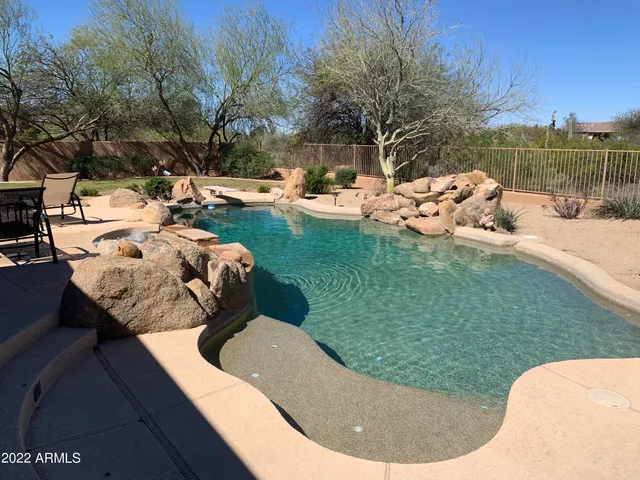 a dining table with chairs and a table