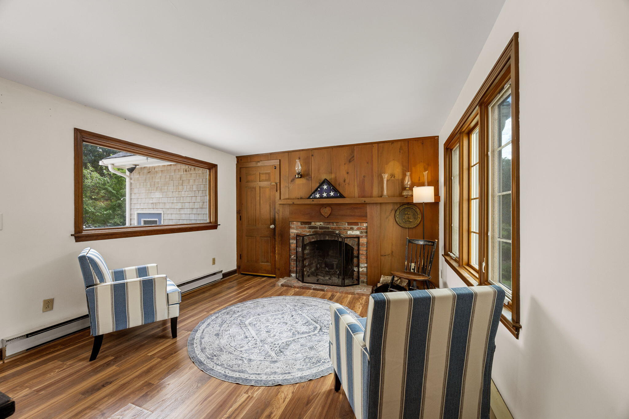 7 Horseshoe Circle Sandwich, MA 02563 - Photo 16 of 92 a living room with furniture a fireplace and a flat screen tv