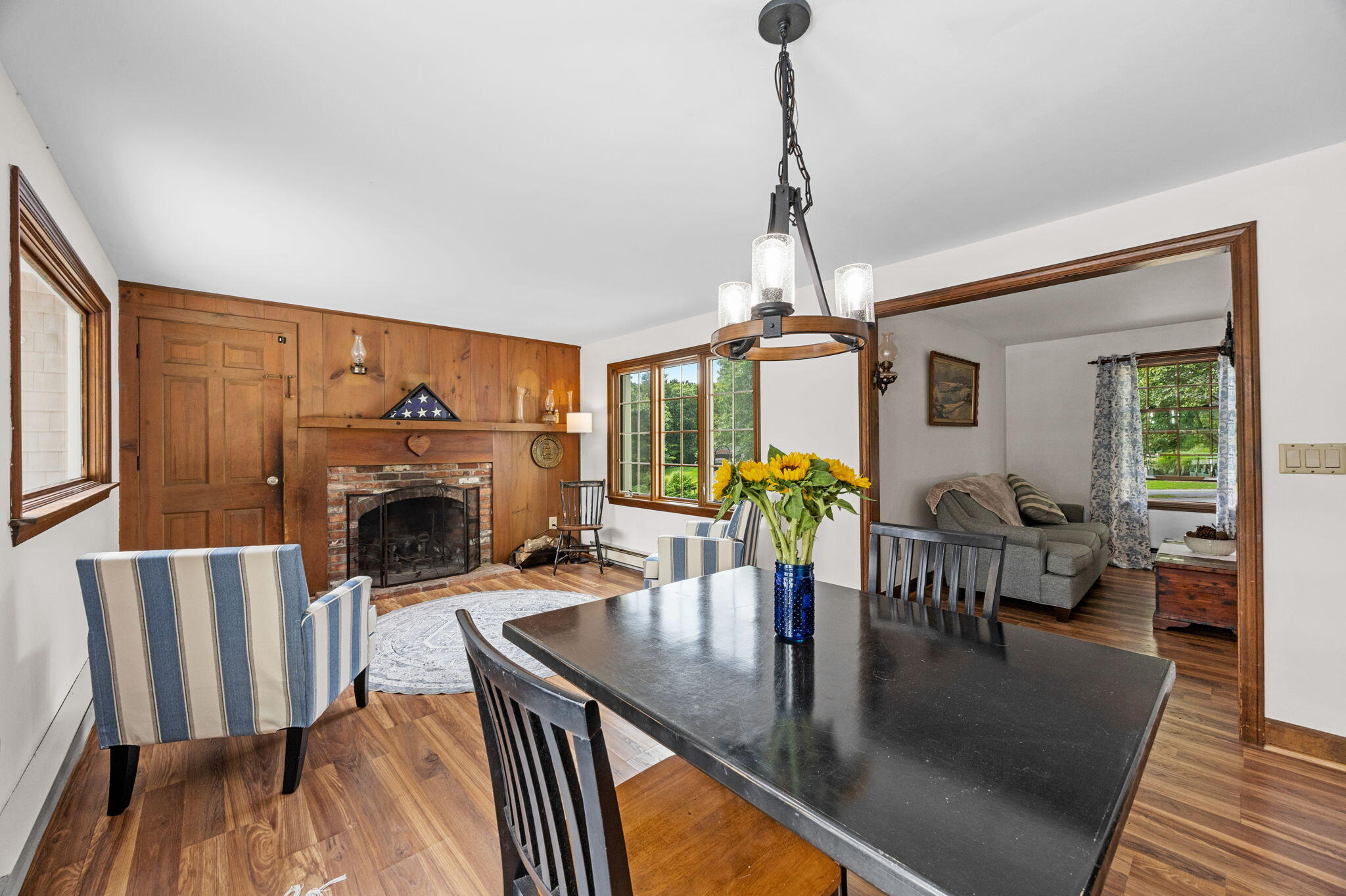 7 Horseshoe Circle Sandwich, MA 02563 - Photo 18 of 92 a living room with furniture a fireplace and a dining table with wooden floor