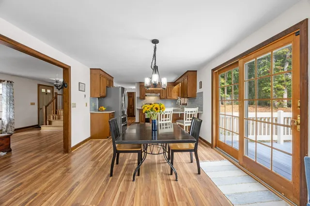 a white toilet sitting next to a bathroom sink and vanity
