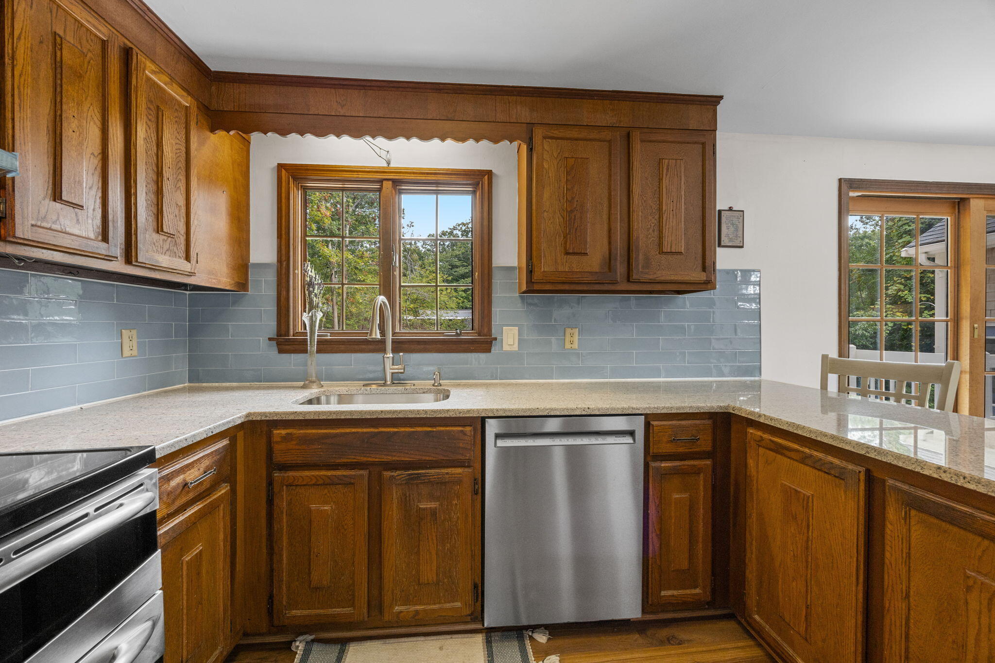 7 Horseshoe Circle Sandwich, MA 02563 - Photo 22 of 92 a kitchen with granite countertop wooden cabinets a sink and a window