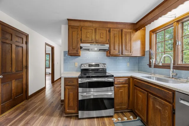 a bathroom with a sink toilet and mirror