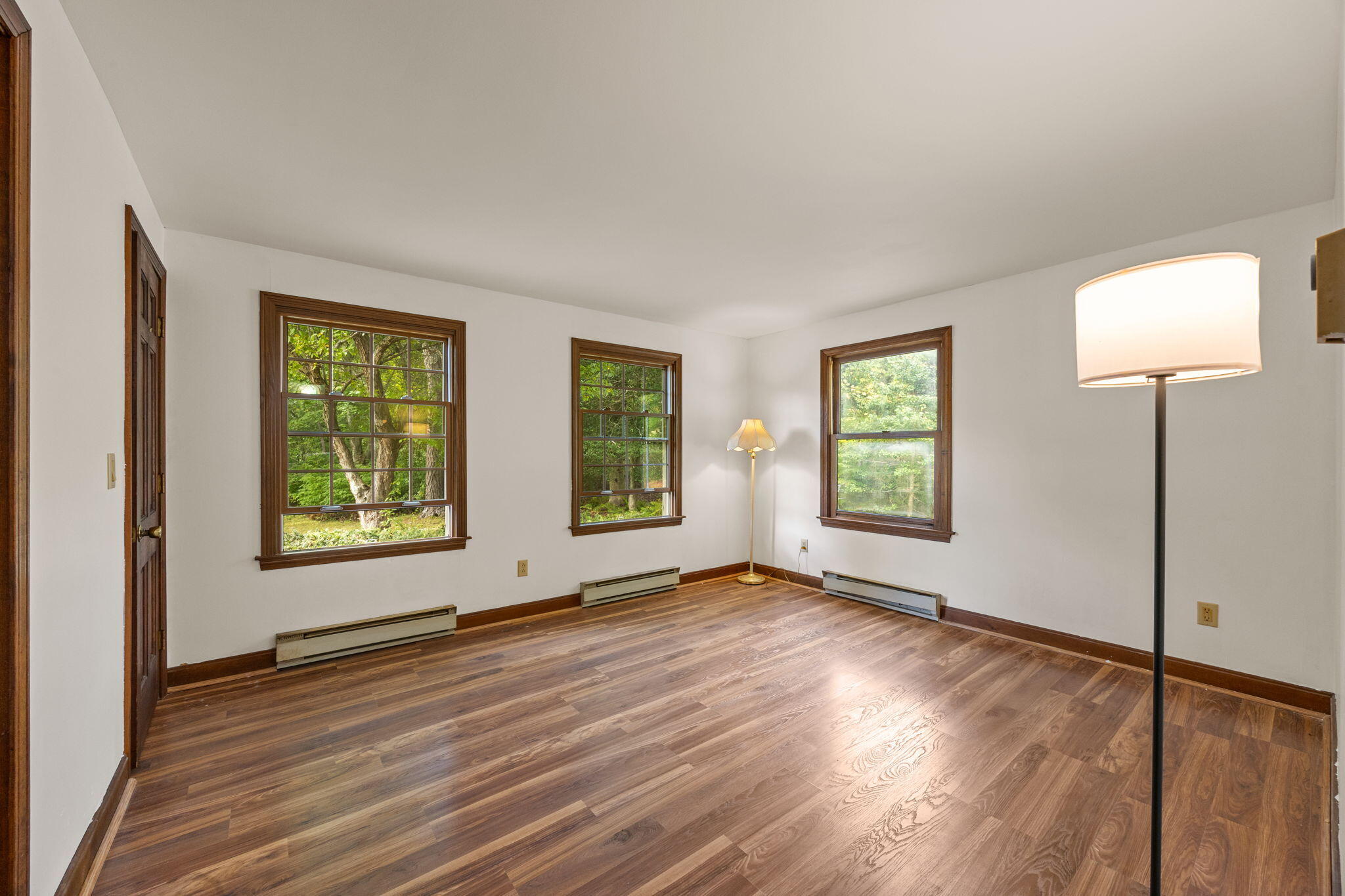 7 Horseshoe Circle Sandwich, MA 02563 - Photo 28 of 92 a view of an empty room with wooden floor and a window