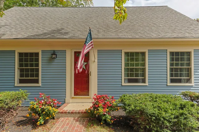 a front view of a house with a yard