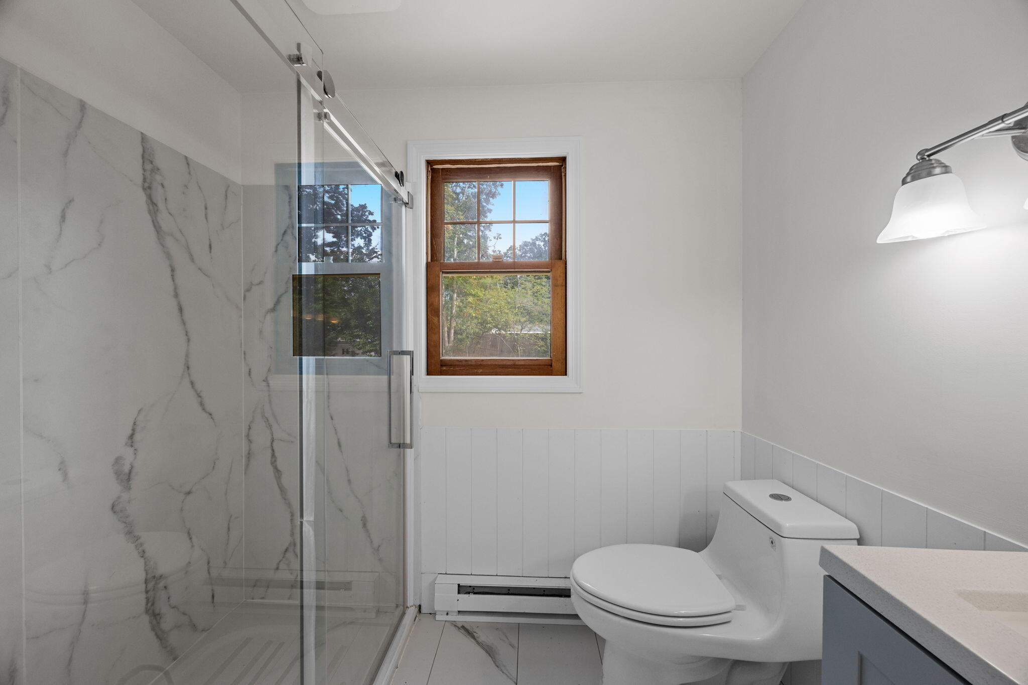 7 Horseshoe Circle Sandwich, MA 02563 - Photo 31 of 92 a white toilet sitting next to a bathroom sink and vanity