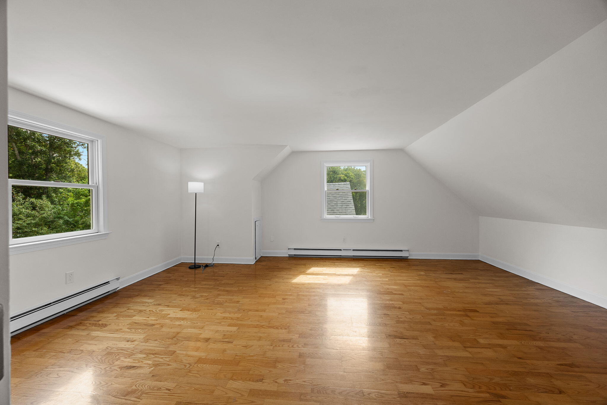 7 Horseshoe Circle Sandwich, MA 02563 - Photo 34 of 92 a view of an empty room with a window and wooden floor