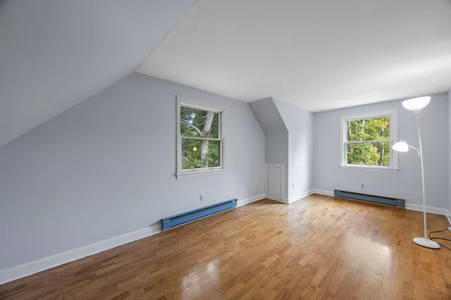 a view of a balcony with wooden floor