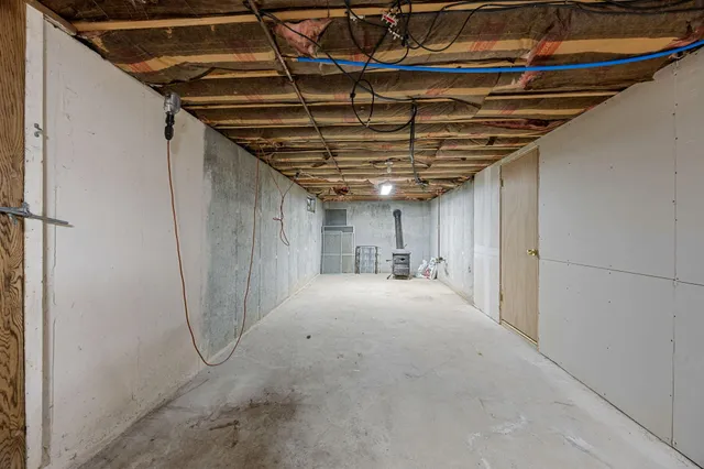 a view of a small house in the middle of a yard