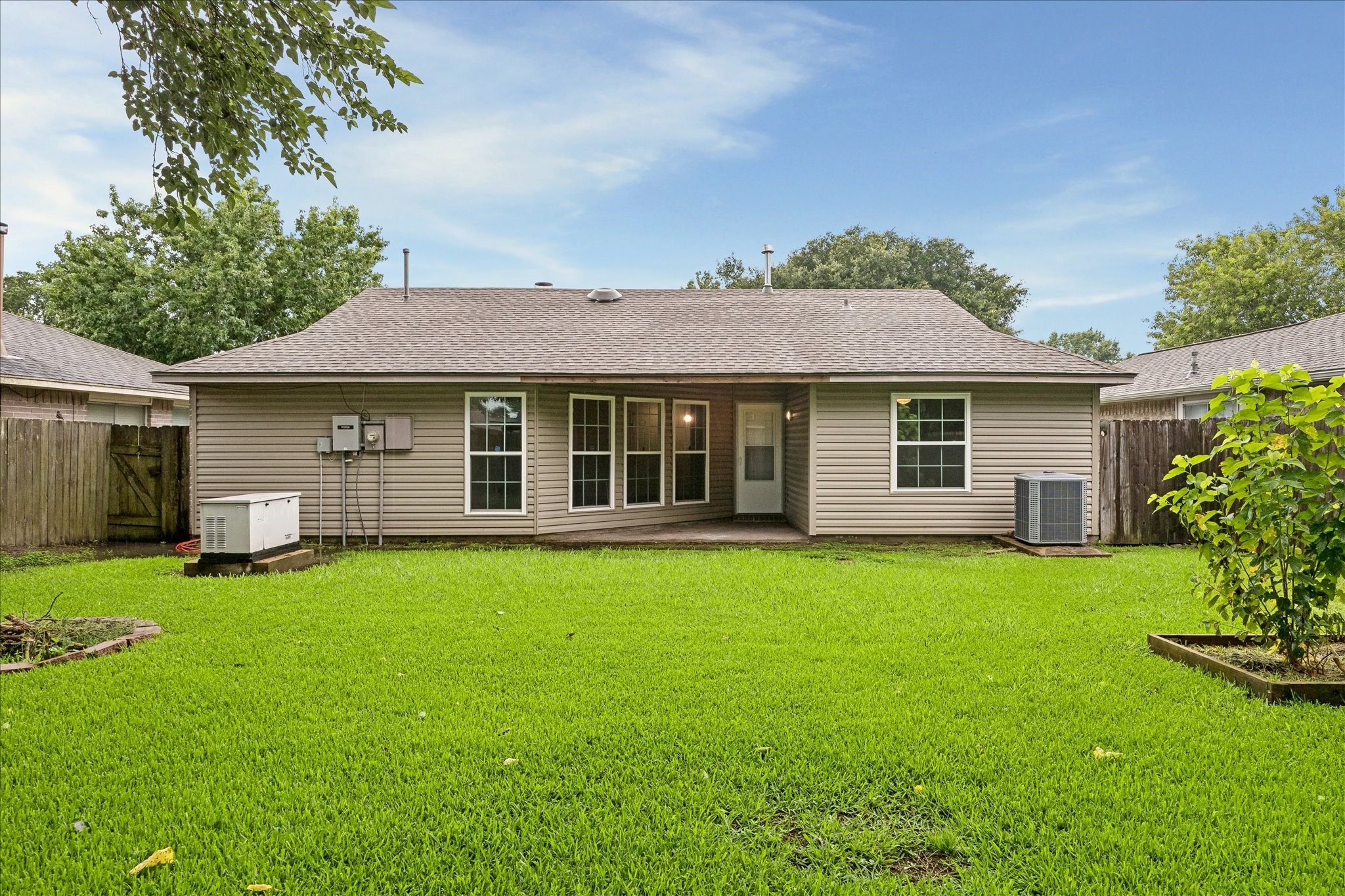 16715 Benchmark Drive Houston, TX 77053 - Photo 13 of 14 a front view of a house with a garden