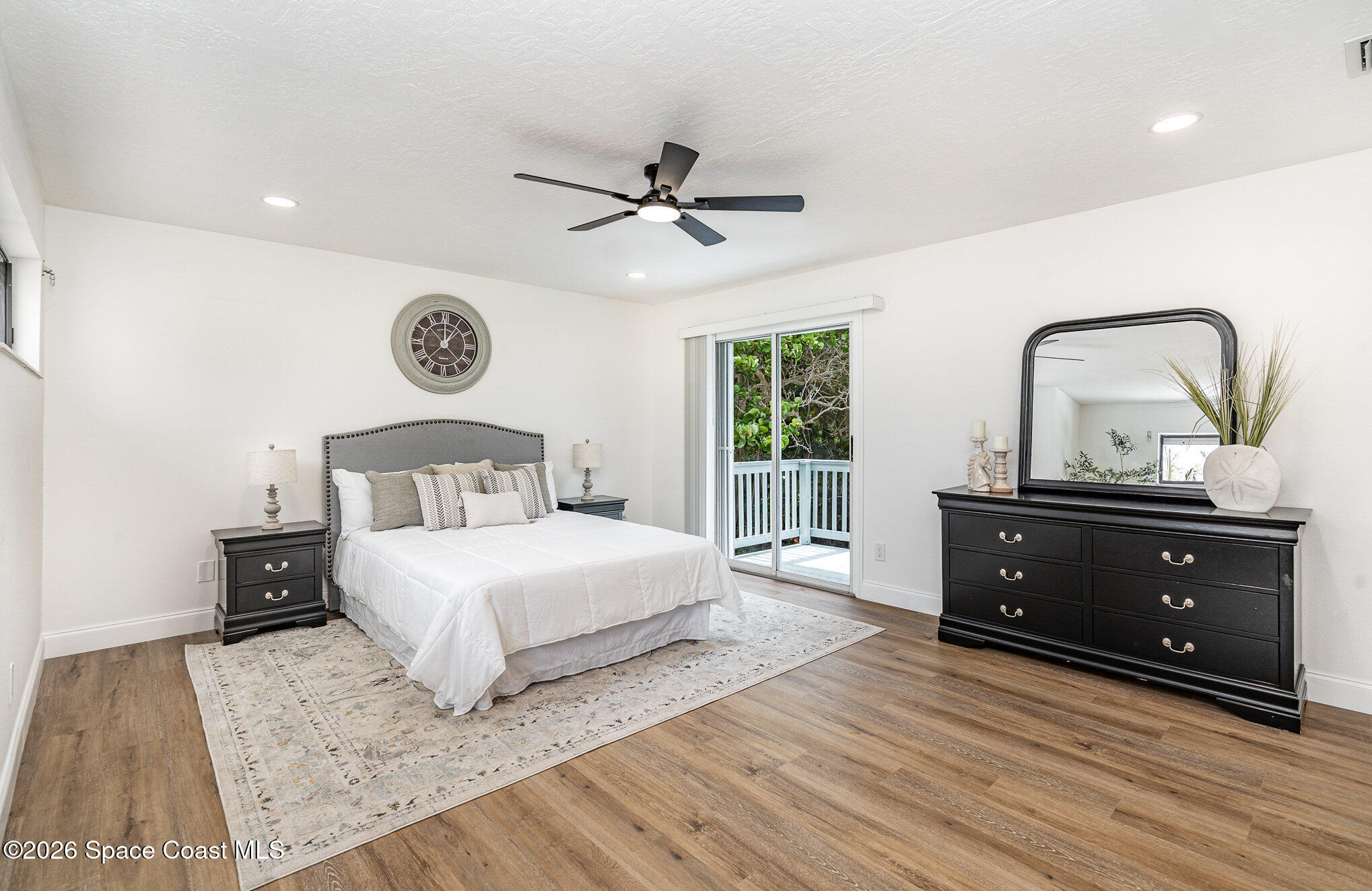 362 Nikomas Way Melbourne Beach, FL 32951 - Photo 11 of 32 a bedroom with a bed and window