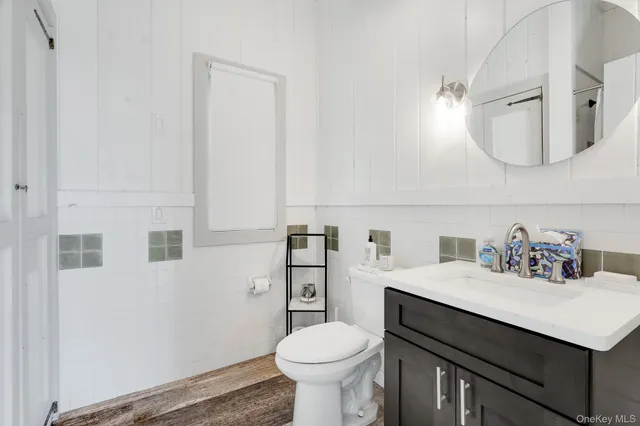 a kitchen with a stove a sink and a refrigerator
