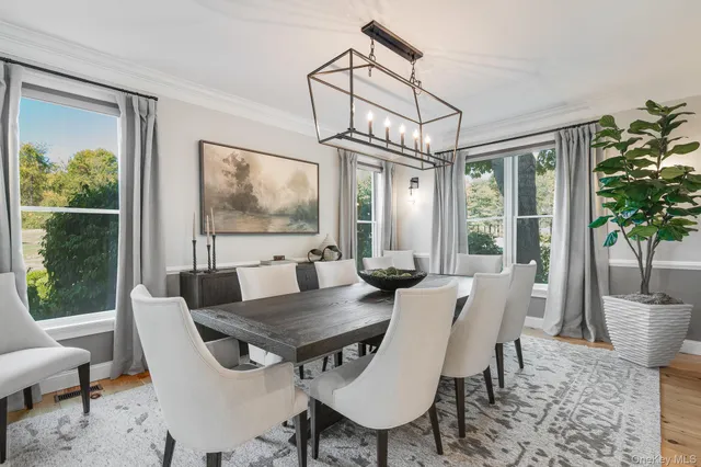 a view of a dining room with furniture window and outside view
