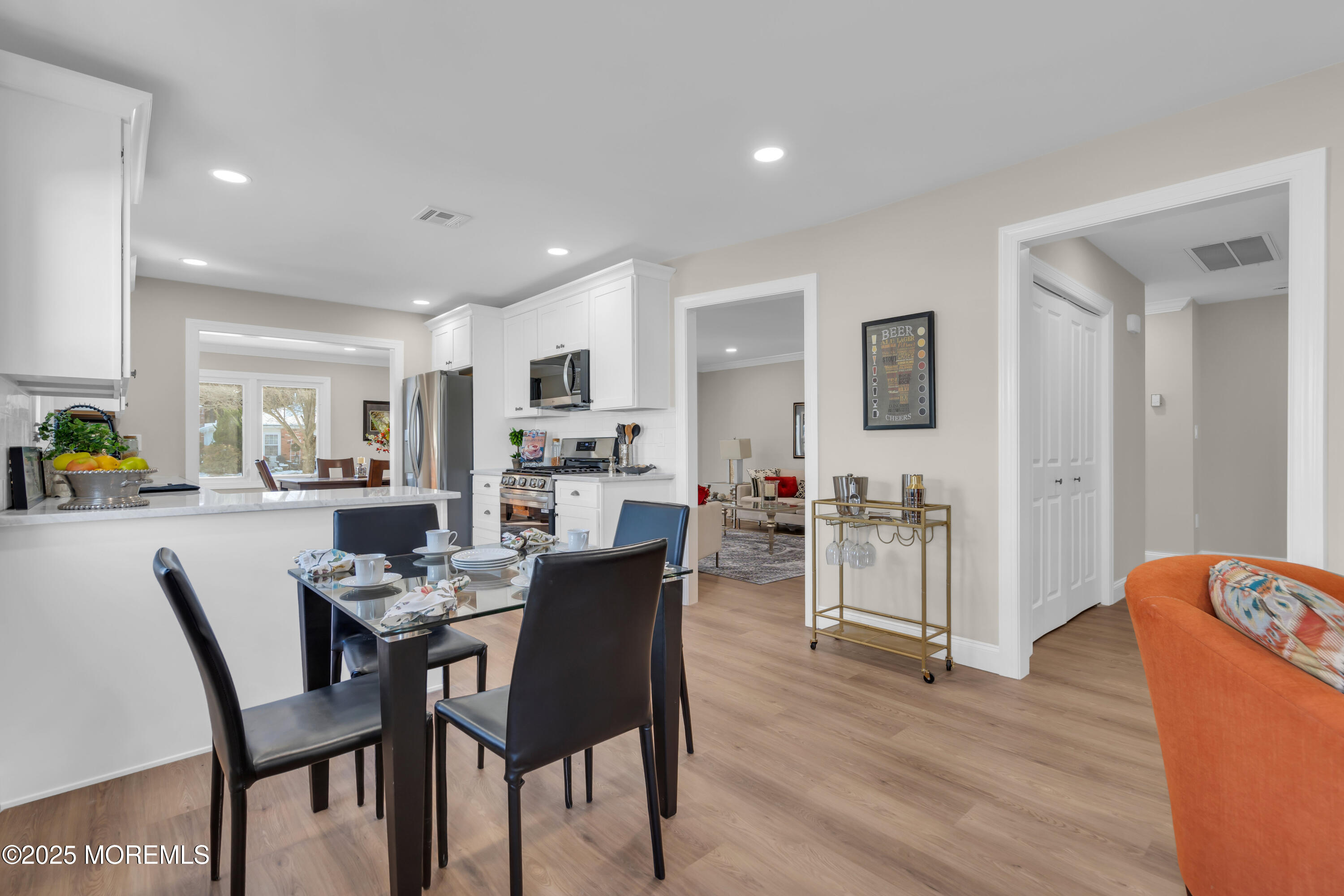 18 Meadowbrook Road Brick, NJ 08723 - Photo 13 of 47 a view of a dining room with furniture and wooden floor