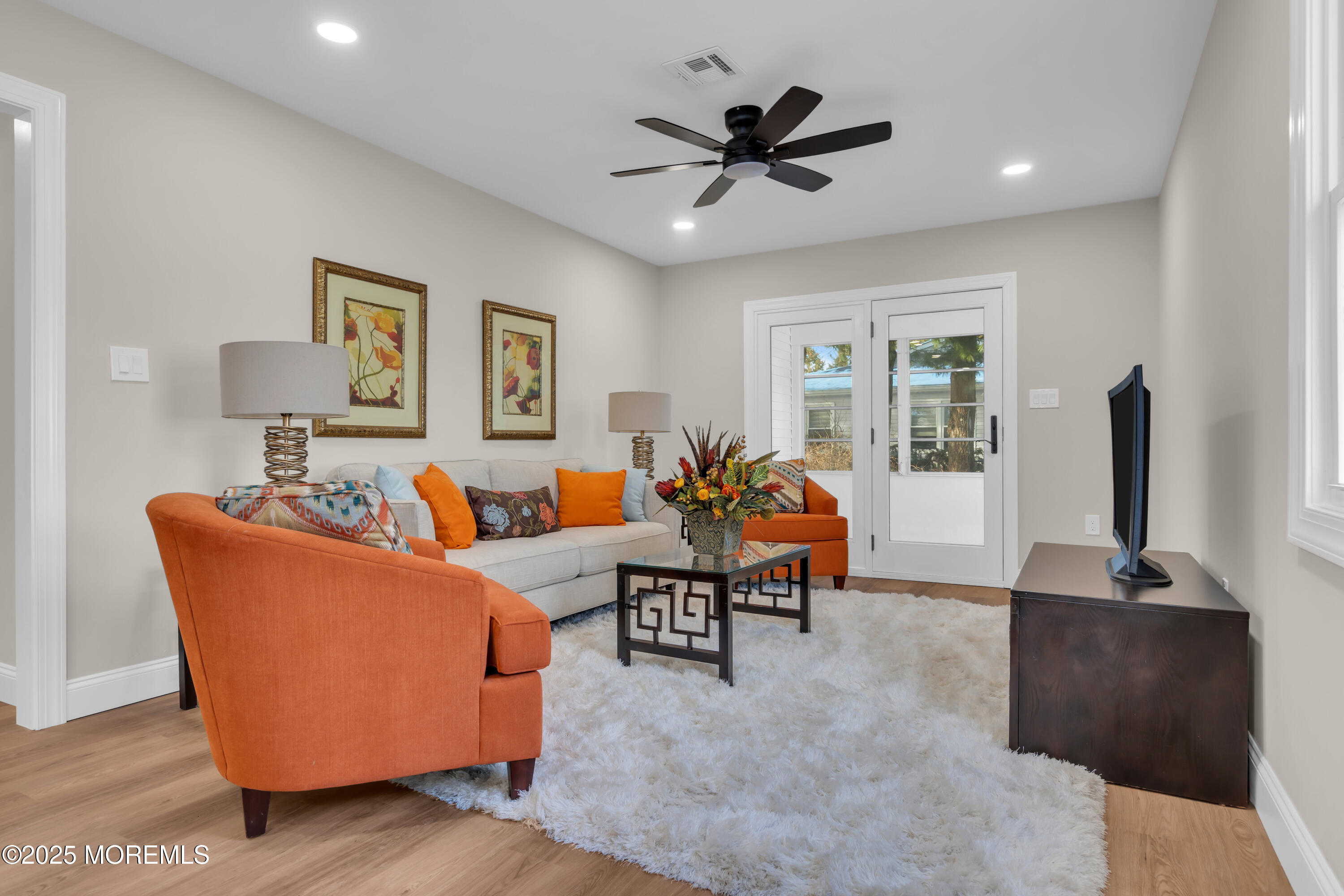 18 Meadowbrook Road Brick, NJ 08723 - Photo 20 of 47 a living room with furniture and a flat screen tv
