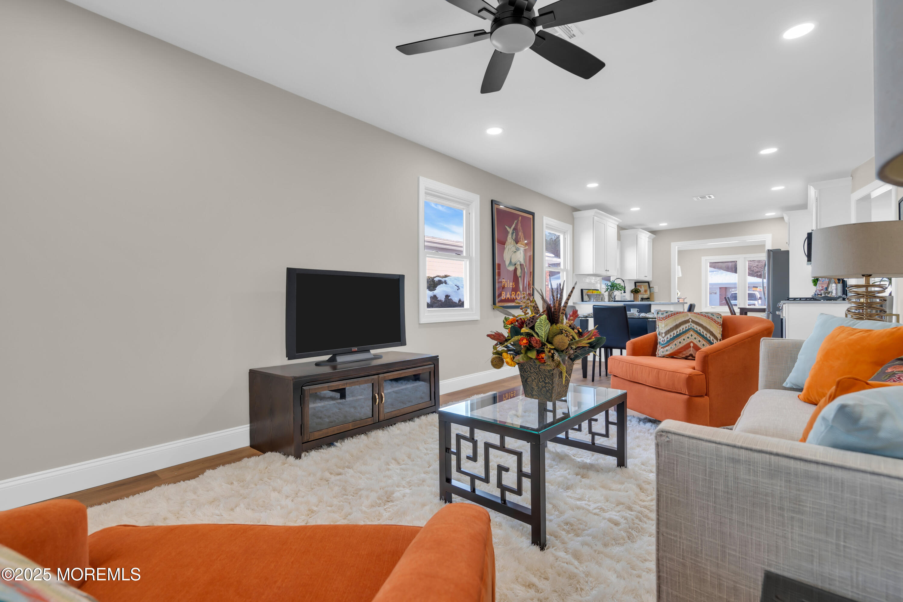 18 Meadowbrook Road Brick, NJ 08723 - Photo 21 of 47 a living room with furniture kitchen view and a flat screen tv