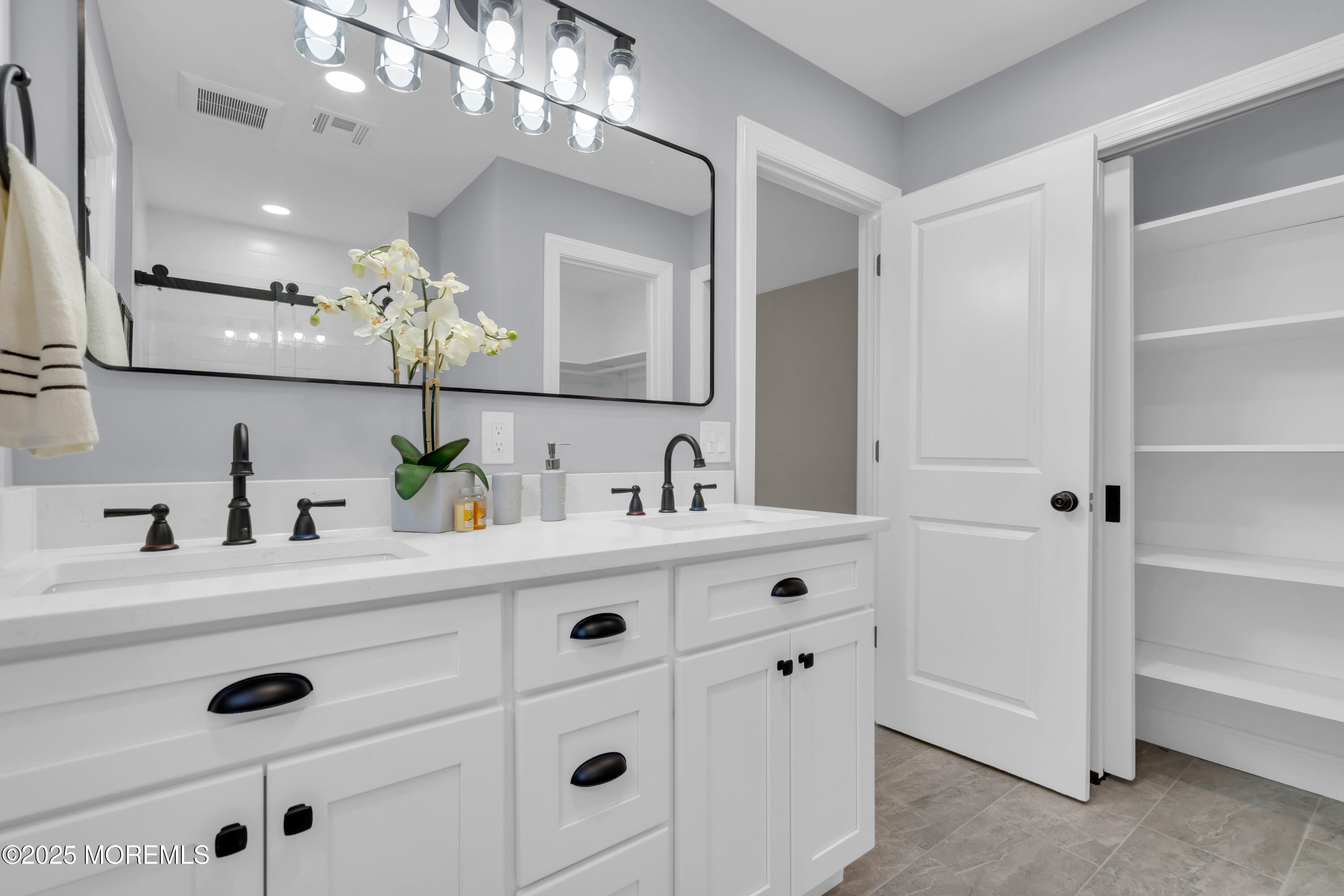 18 Meadowbrook Road Brick, NJ 08723 - Photo 31 of 47 a bathroom with a sink vanity and mirror