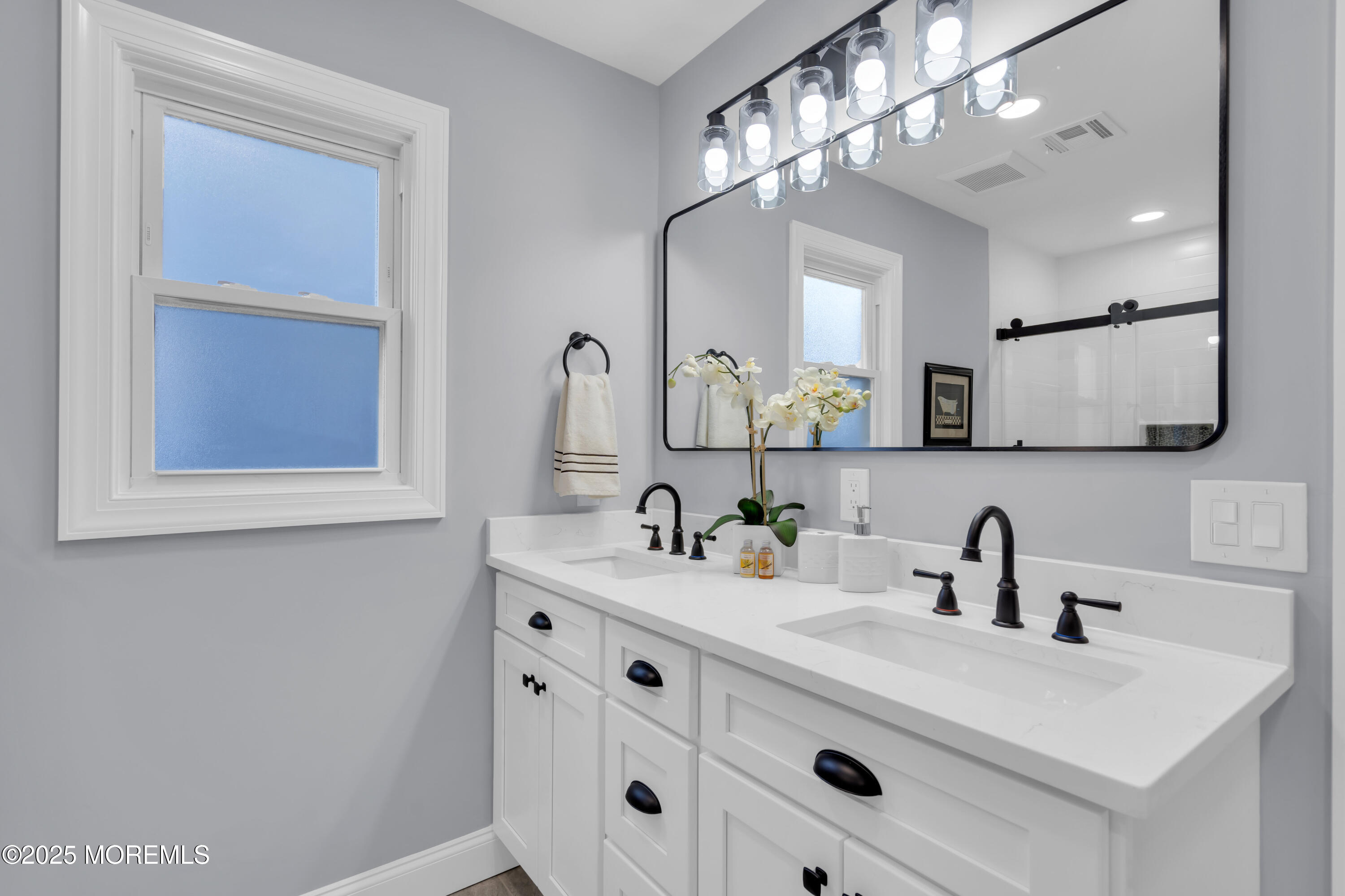 18 Meadowbrook Road Brick, NJ 08723 - Photo 33 of 47 a bathroom with a sink double vanity and a mirror