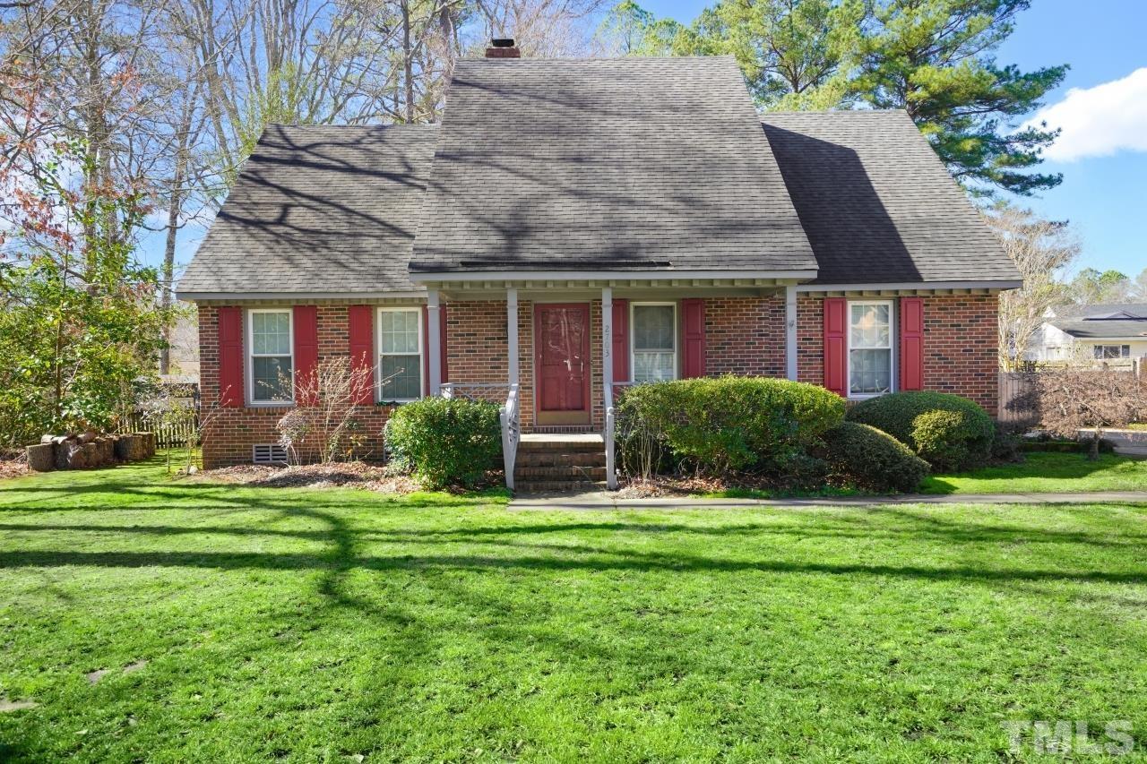 a front view of house with yard outdoor seating and green space