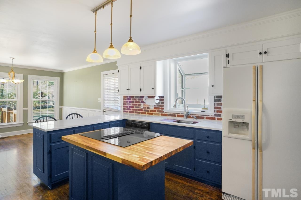 2703 Ridge Road Northwest Wilson, NC 27896 - Photo 12 of 33 a kitchen with a counter space a sink and cabinets