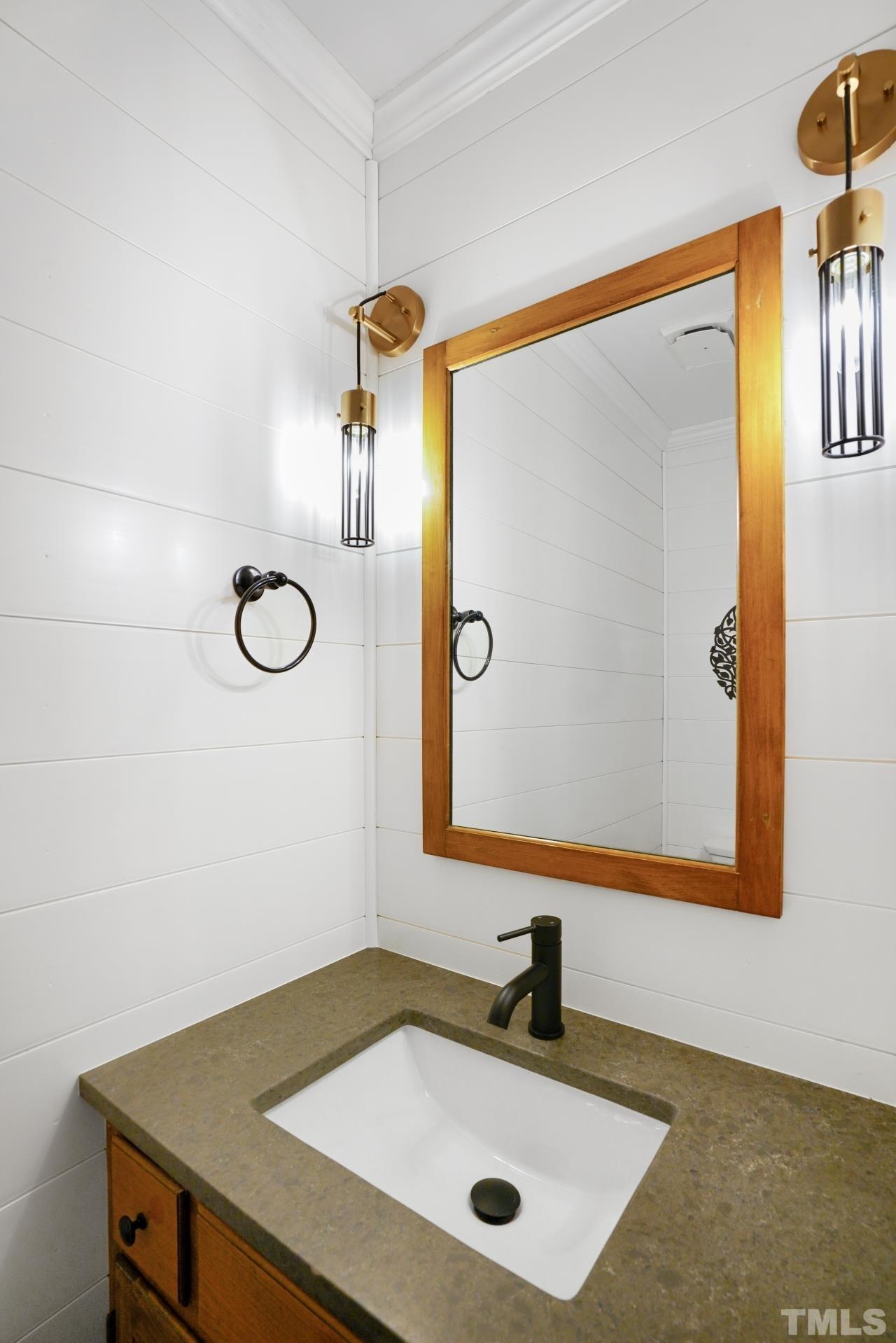 2703 Ridge Road Northwest Wilson, NC 27896 - Photo 16 of 33 a bathroom with a sink and a mirror