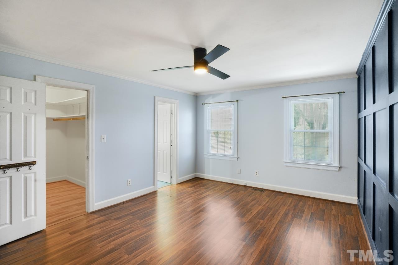 2703 Ridge Road Northwest Wilson, NC 27896 - Photo 17 of 33 wooden floor in an empty room with a window
