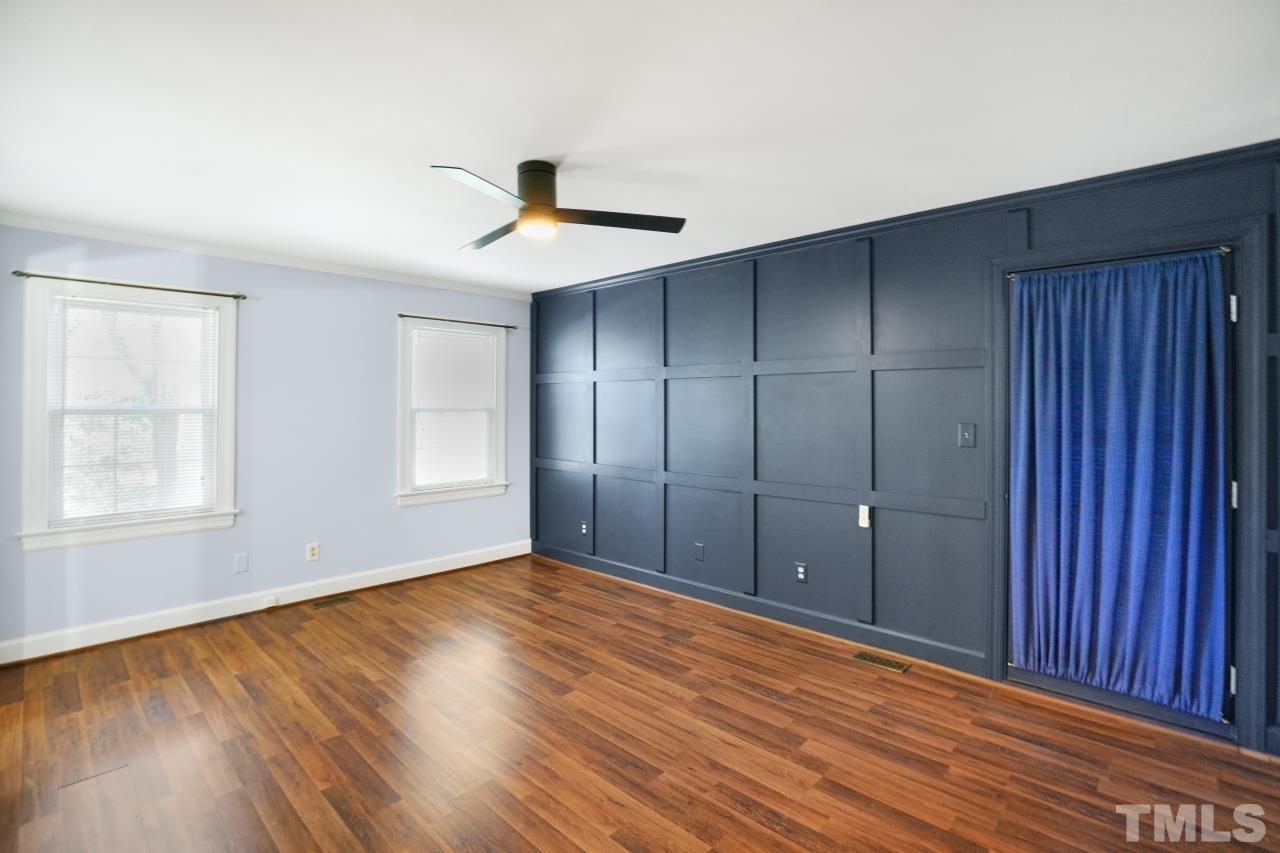2703 Ridge Road Northwest Wilson, NC 27896 - Photo 19 of 33 an empty room with wooden floor and windows