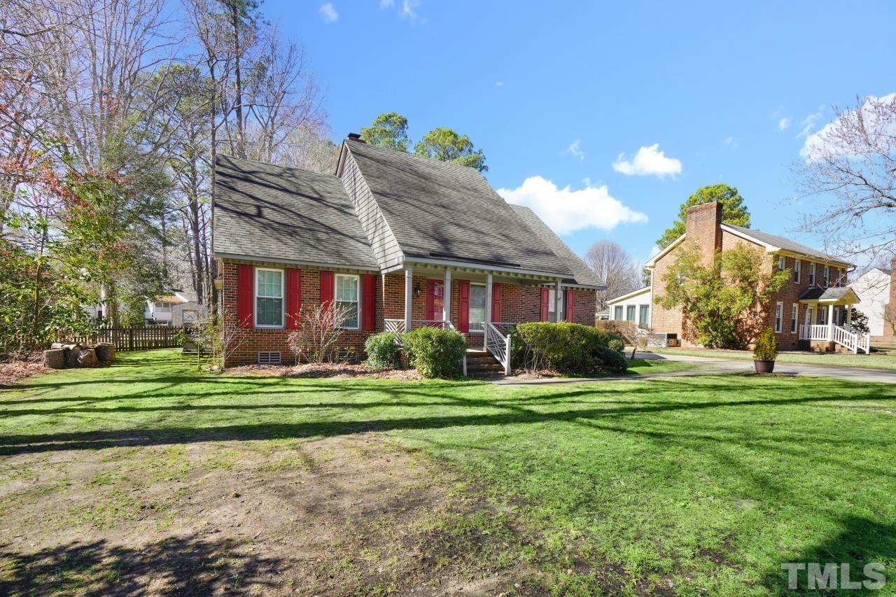 2703 Ridge Road Northwest Wilson, NC 27896 - Photo 2 of 33 a view of a house next to a big yard with plants and large trees