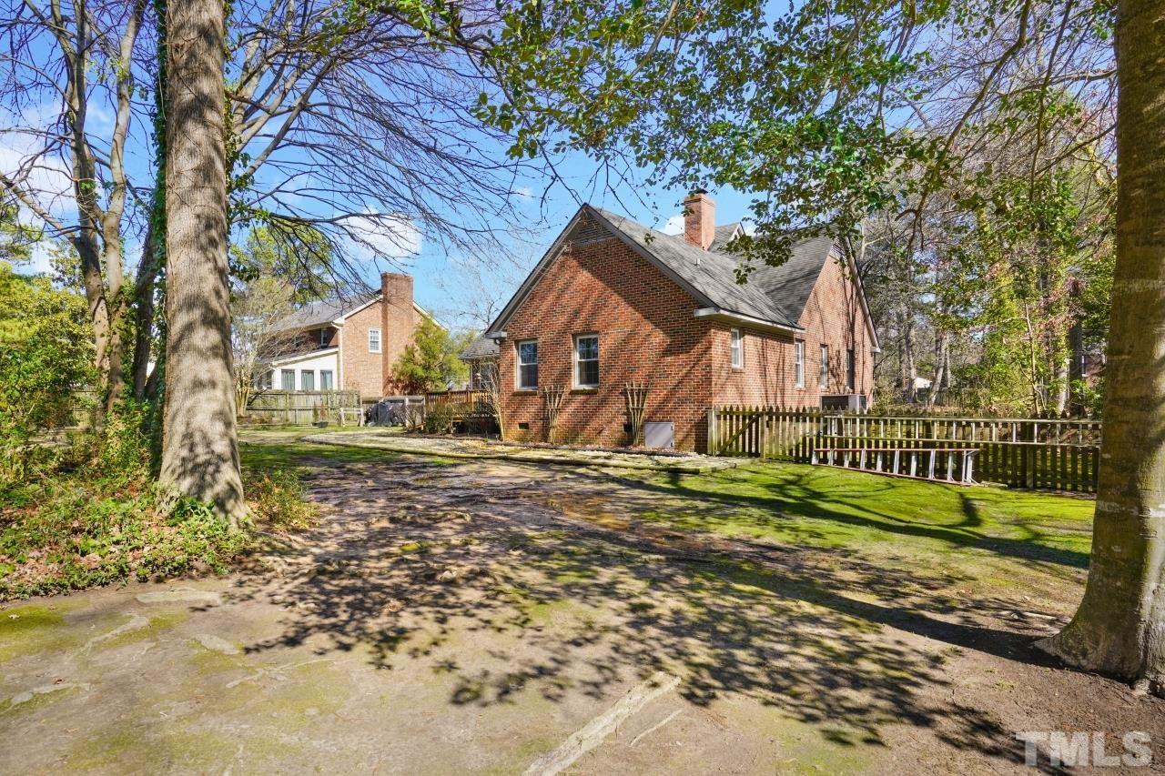 2703 Ridge Road Northwest Wilson, NC 27896 - Photo 29 of 33 a view of a house with a yard and large tree