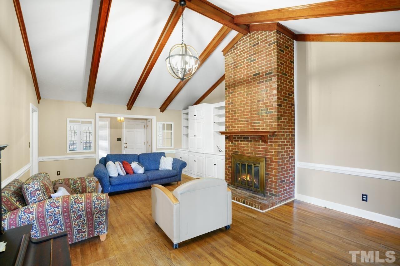 2703 Ridge Road Northwest Wilson, NC 27896 - Photo 6 of 33 a living room with furniture and a fireplace