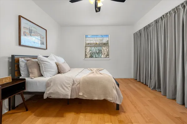 a bedroom with bed and window